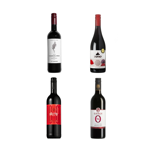 Four bottles of wine with different labels on a white background