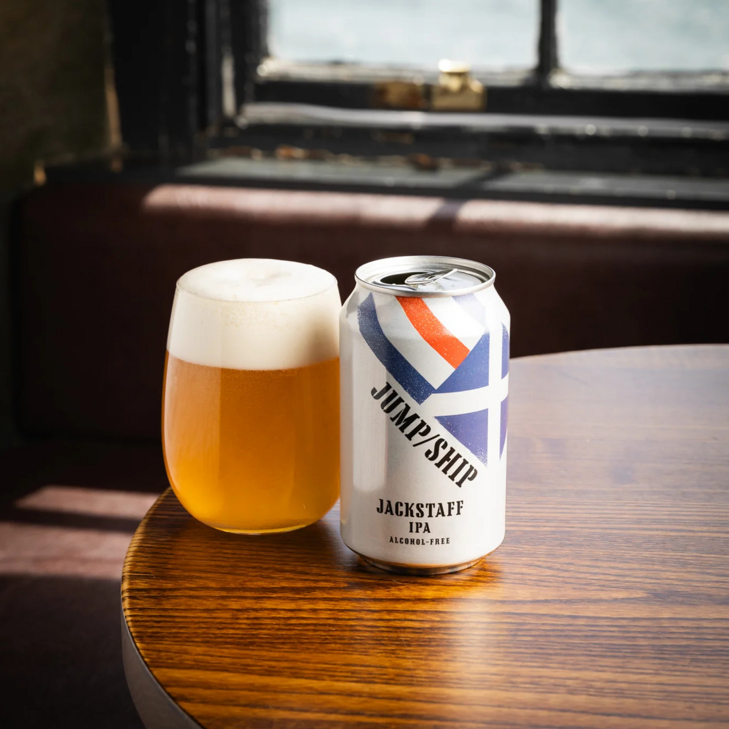 Jump/Ship Jackstaff Alcoholic IPA with glass on table