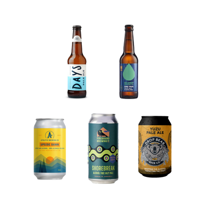 Collection of five different beer bottles and cans on a white background