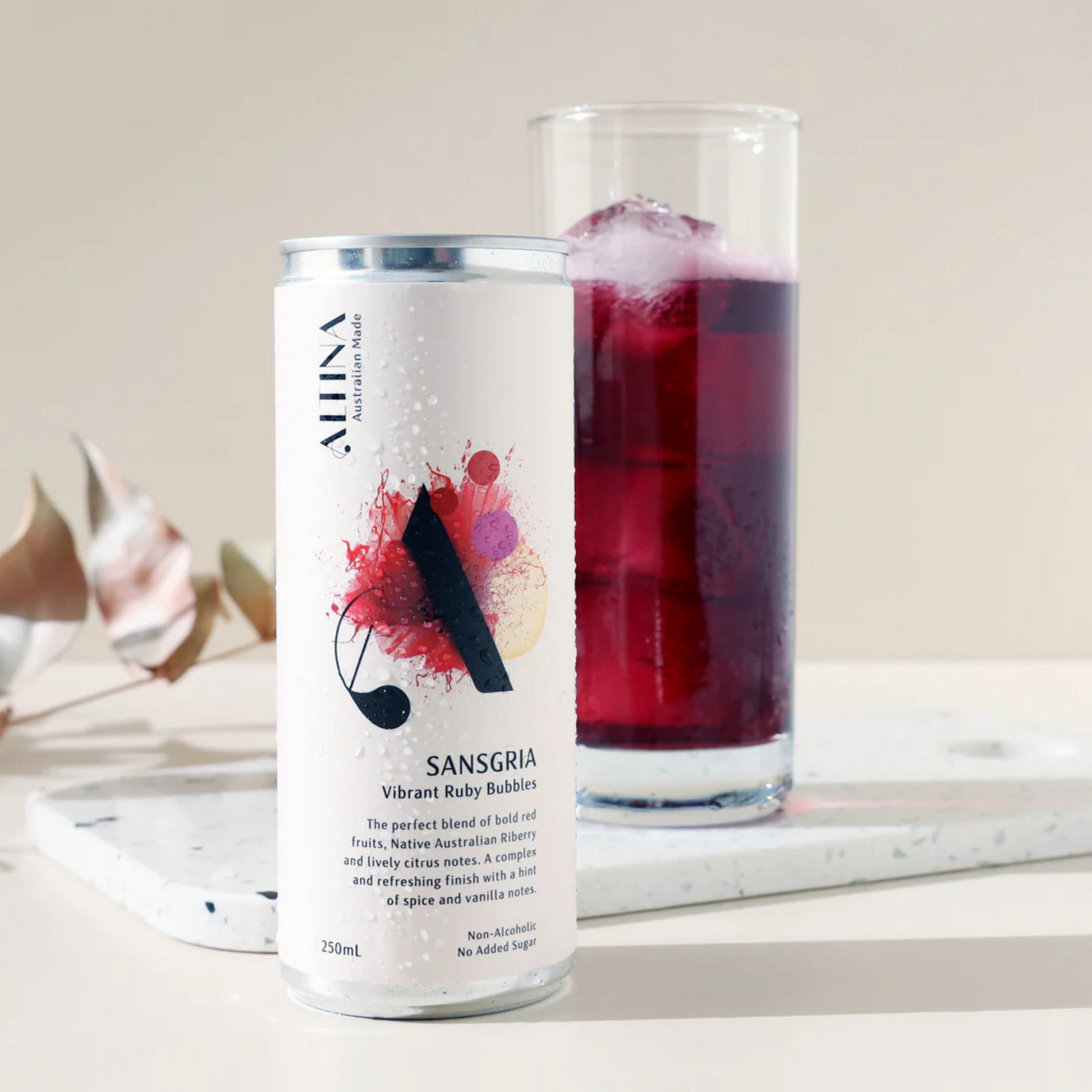 Alina Sangria can with a glass of sangria on a marble surface
