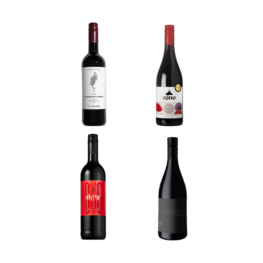 Four bottles of wine with different labels on a white background
