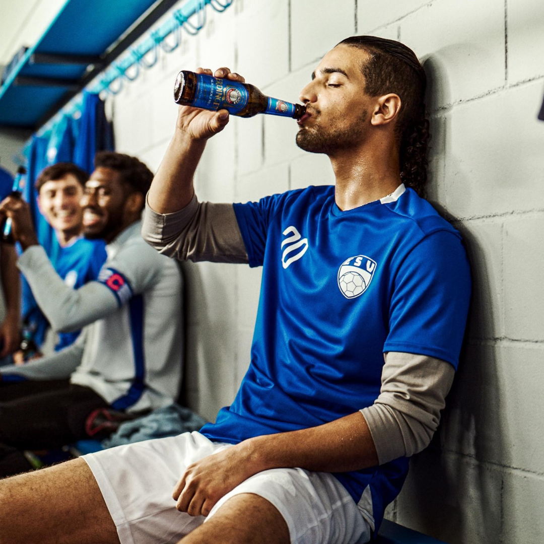 Erdinger Alkoholfrei - Man Drinking After Football