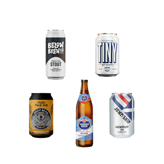 Collection of beer cans and bottles from different breweries on a white background