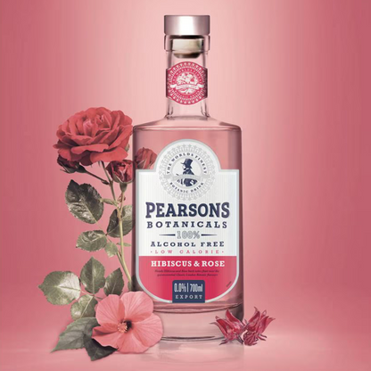 Pearsons Botanicals hibiscus & rose alcohol-free drink bottle with flowers on a pink background