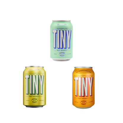 Three cans of Tiny beer in different colors on a white background